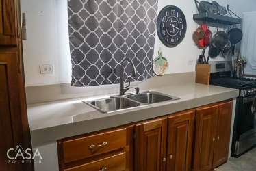 Exterior yellow beach house close to sandy shore in Panama Pacific Coast