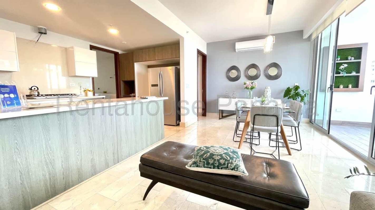 Bright living dining room with marble floors, balcony ocean views at PH Coco del Mar Tower Panama