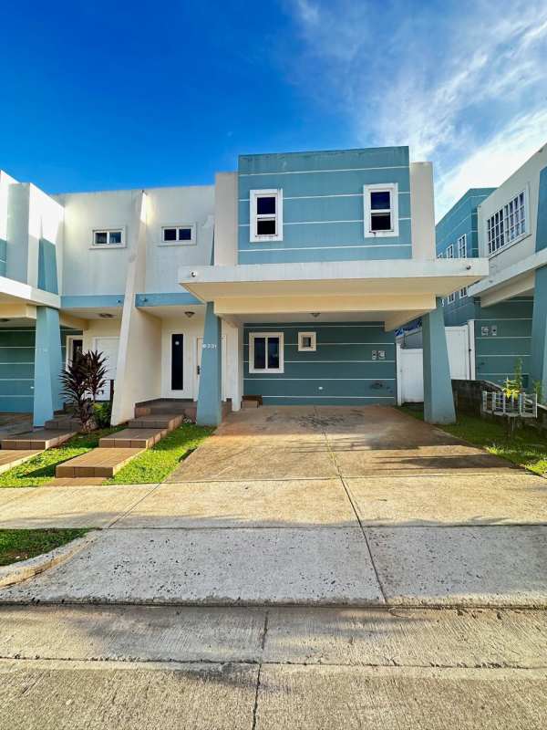 Spacious tiled living room with staircase and access to backyard terrace PH Los Alpes Brisas del Golf