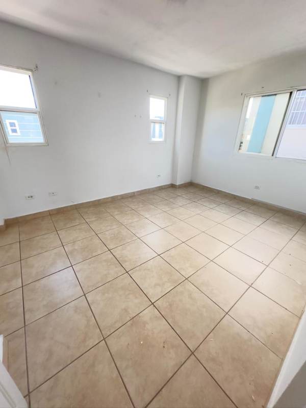 Empty bedroom with beige ceramic floor and single window PH Los Alpes Brisas del Golf Panama