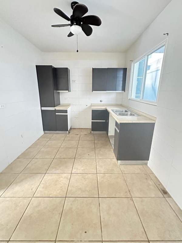 Empty bedroom with window, tile floors, closet nook in PH Los Alpes Brisas del Golf Panama