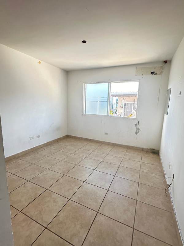 Tiled bedroom with window and minimal finishes PH Los Alpes Brisas del Golf Panama
