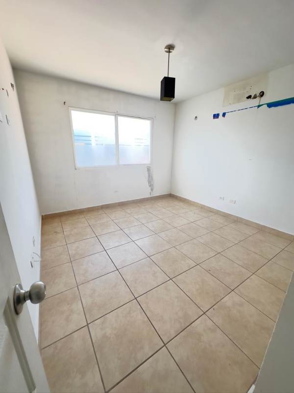 Unfurnished bedroom with window, tile floor, pendant lamp PH Los Alpes Brisas del Golf Panama