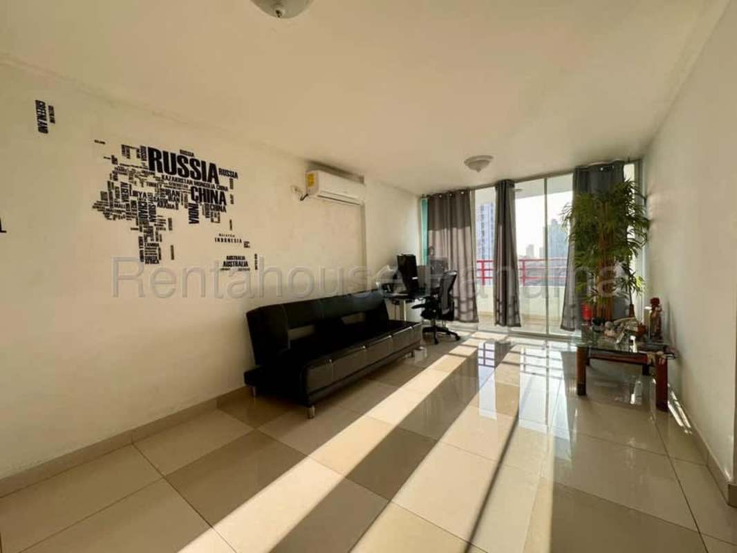 Bright open living room with tile floors and balcony access in PH Torres de Vista Hermosa Panama City