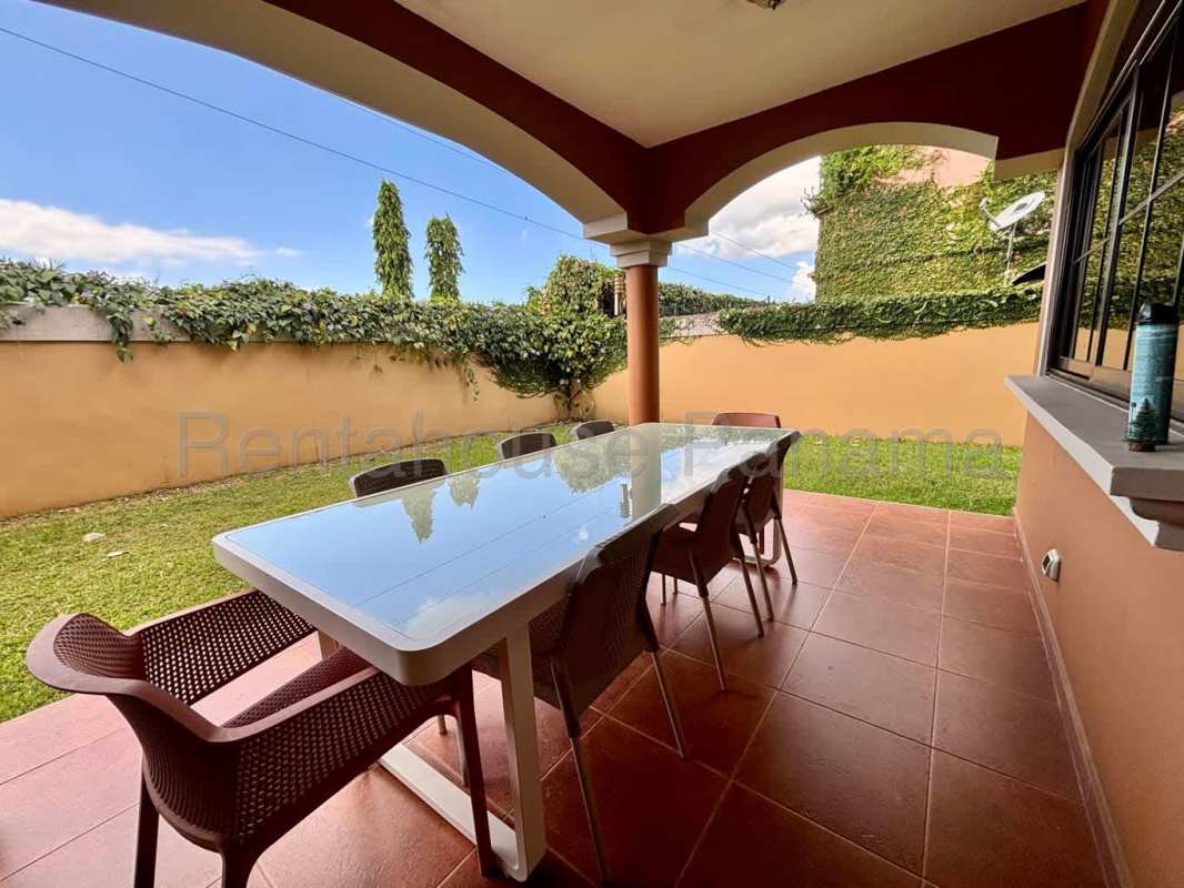 Enclosed backyard with green lawn, privacy wall and landscaping Costa Sur Panama