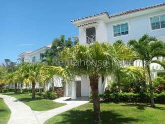 Bright open living and dining room with access to balcony ocean views in Playa Blanca Panama