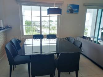 Modern kitchen with granite countertops and appliances in Bijao Beach Residences Panama