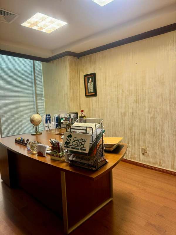 Private corporate office with wooden furnishings and globe decor at BICSA Tower Panama