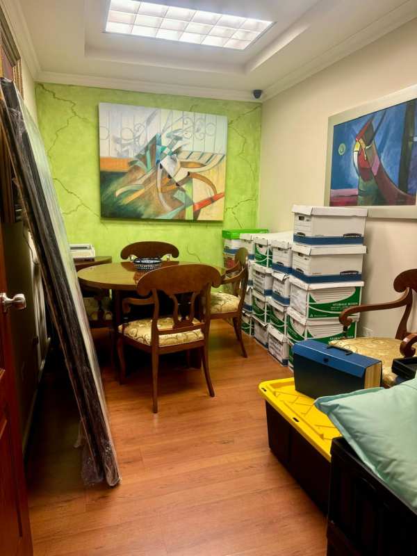 Office room with storage boxes, round table and art at BICSA Tower Marbella Panama