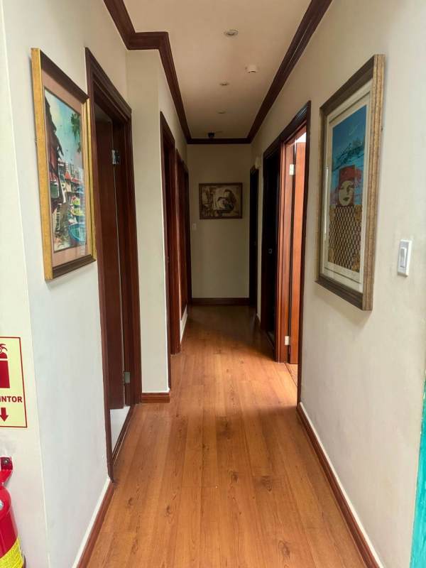 Reception with artwork, hallways leading to offices inside PH BICSA Tower Panama City