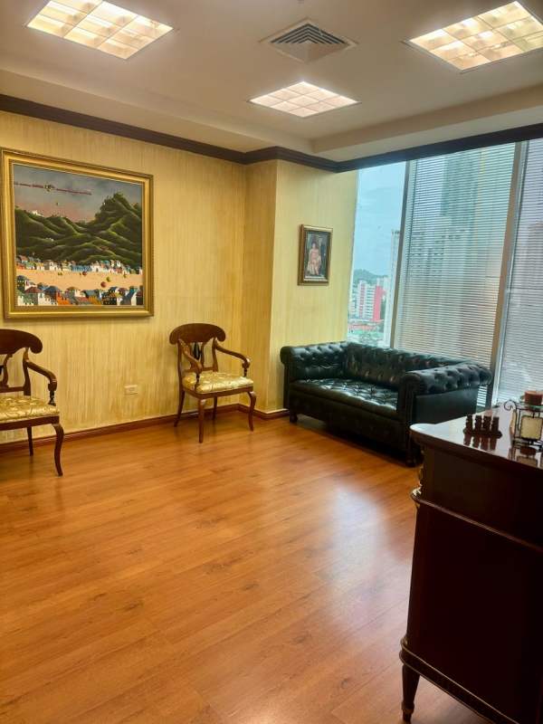 Private executive office with wooden desk, bookshelf, windows at PH BICSA Tower Marbella Panama