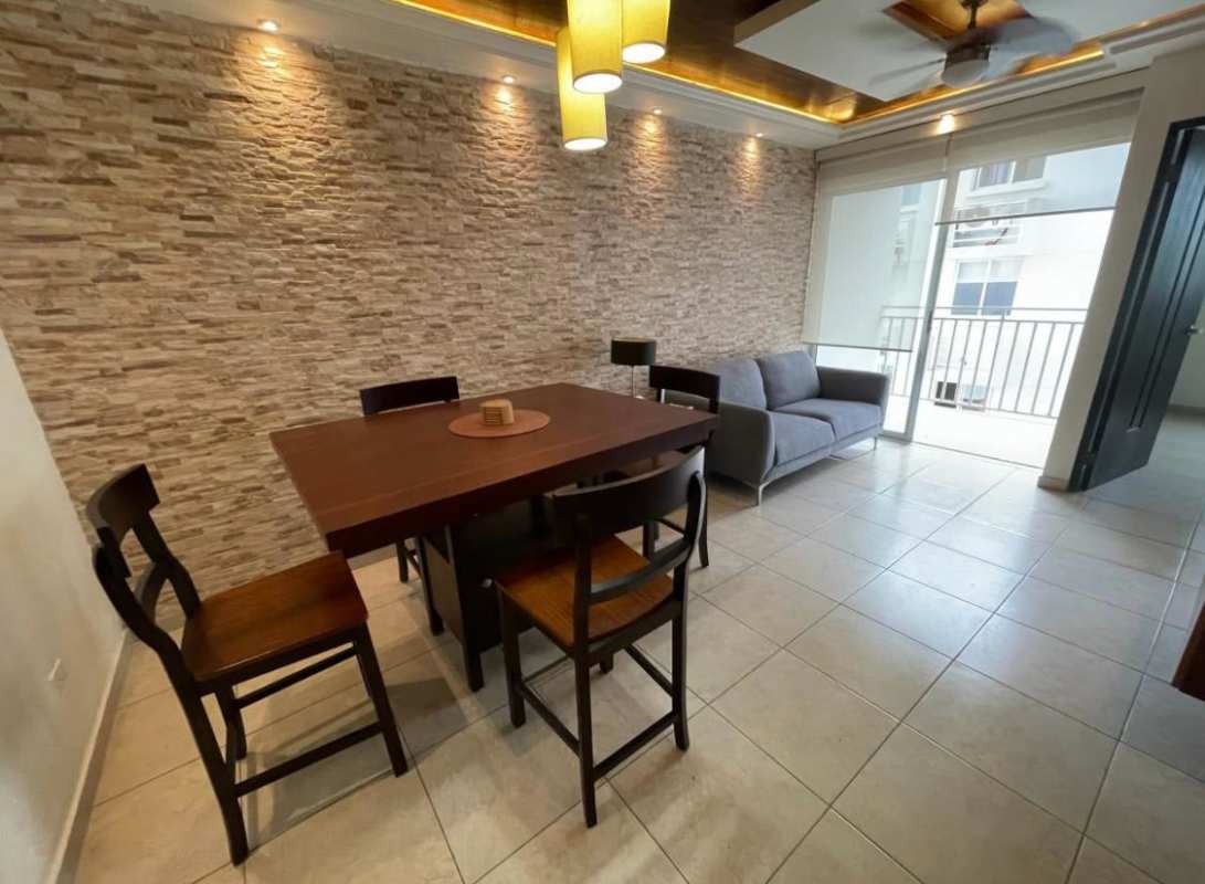 Covered social lounge area with ceiling fans, exposed beams and seating PH Panama City