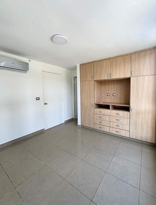 Bright living room with large windows tile floor split AC PH Rokas Dorado Lake Panama City