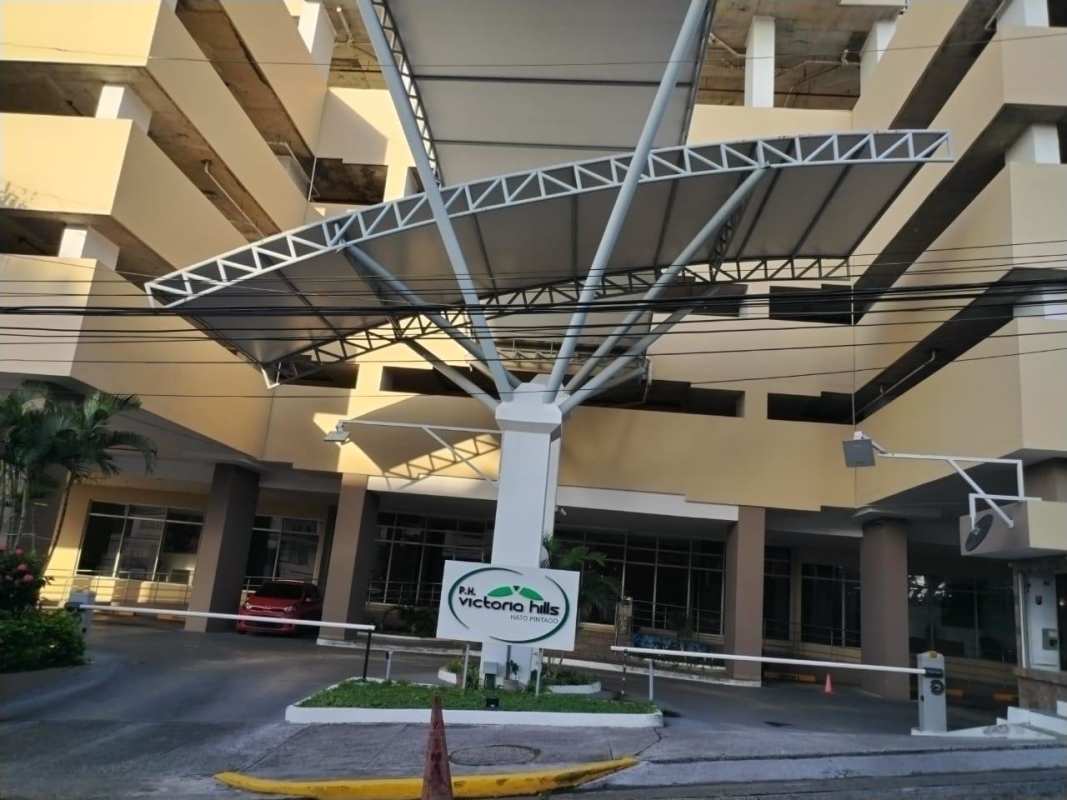 Bedroom with wide window providing cityscape views PH Victoria Hills Panama