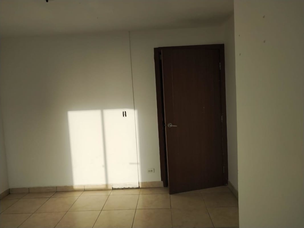 Bright bedroom with large windows and skyline view in PH Victoria Hills Hato Pintado