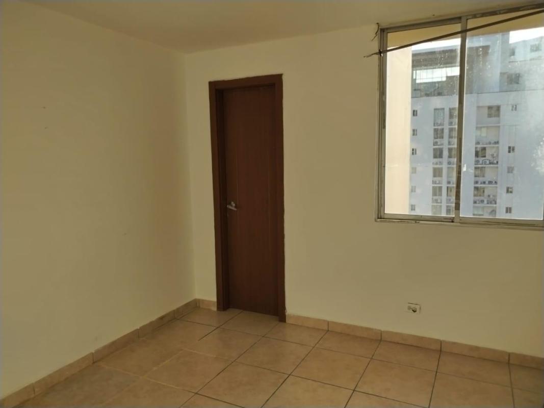 Bedroom with built-in wardrobe and city view window PH Victoria Hills Panama
