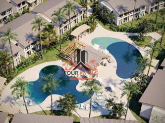 Tropical beachfront resort aerial, palm trees and ocean at PH Aires del Mar Playa Caracol Panama