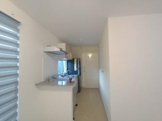 Modern kitchen with granite counter breakfast bar and cabinets in Los Cerezos Cluster house