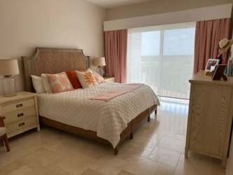 Sophisticated living and dining with panoramic views, marble floors and luxury furniture in Buenaventura penthouse