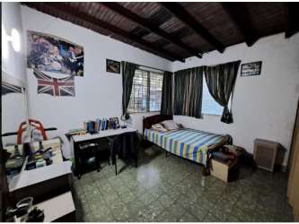 Single-story house with front yard, carport and driveway fenced in Carrasquilla near Parque Omar Panama