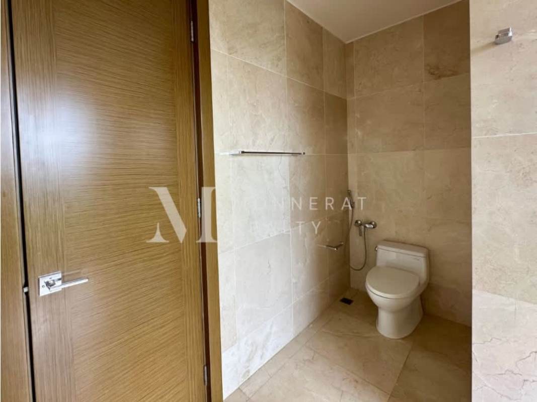 Bright bathroom with large window marble walls sleek vanity The Reserve Santa Maria Panama