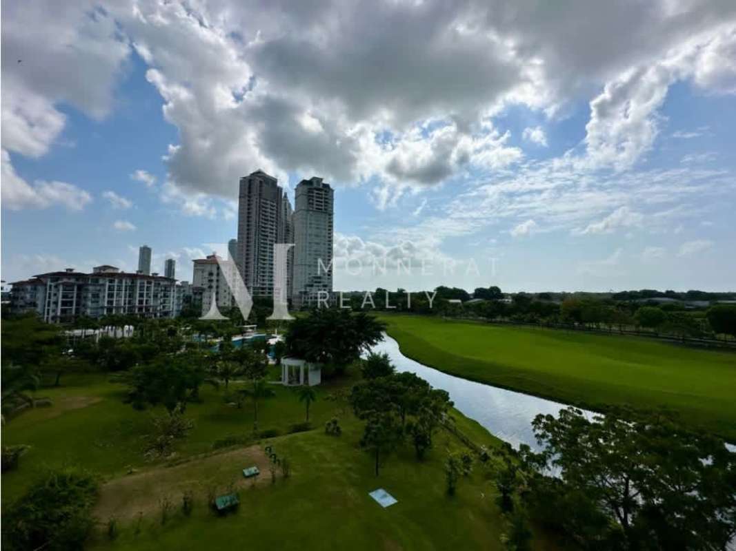 Aerial shot of luxury condos at The Reserve next to green golf course lakes Santa Maria Panama