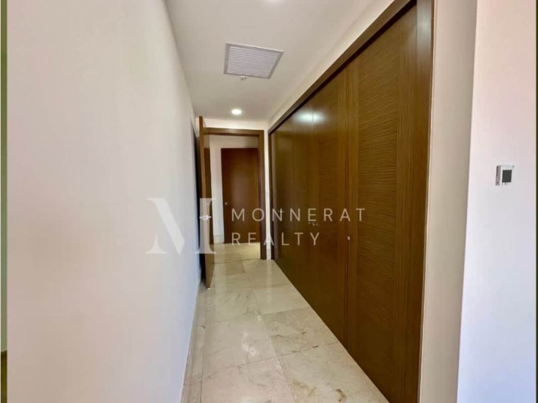 Spacious modern walk-in closet with shelving drawers tile floor in The Reserve Panama