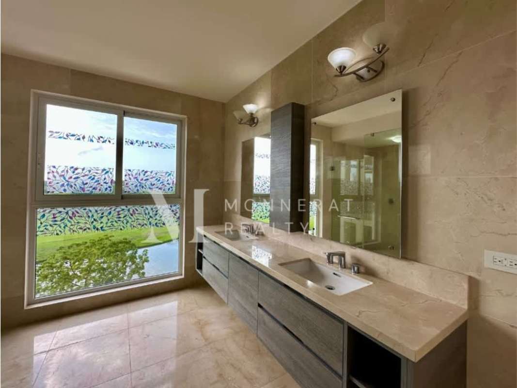 Spacious balcony with iron railing ceiling fan tile floor overlooking golf city Panama