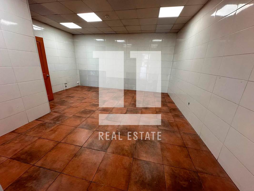 Empty tiled service room with fluorescent lighting Calle 50 Panama