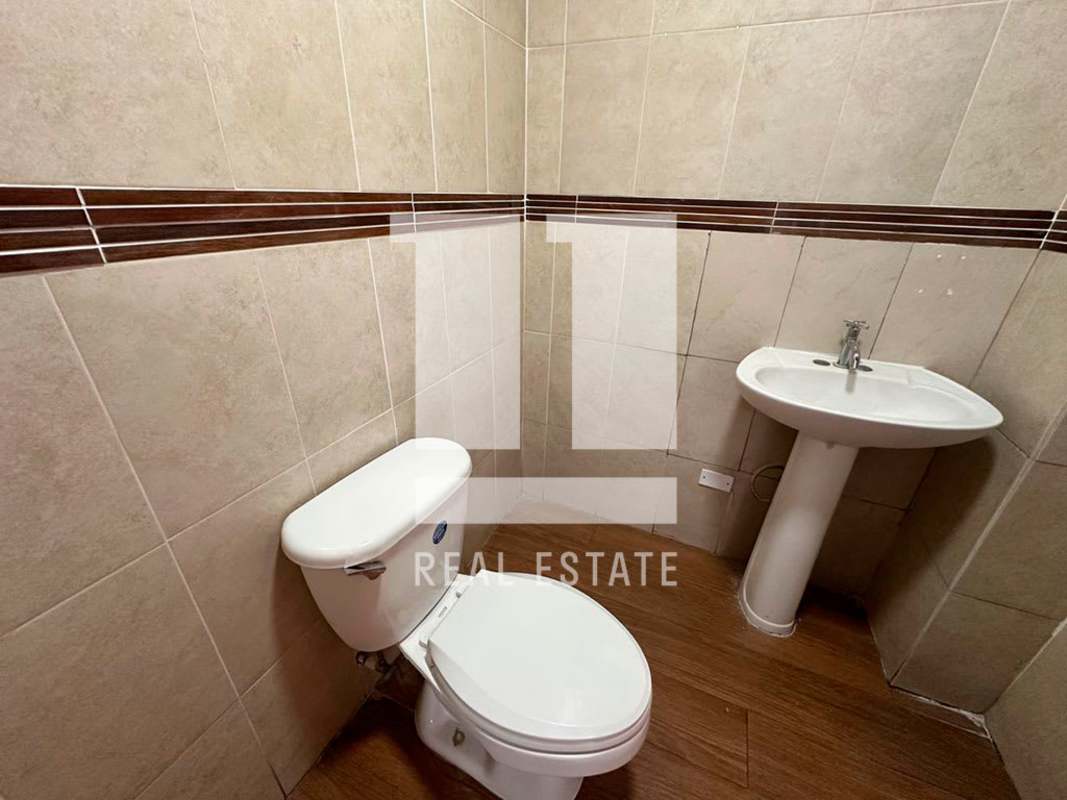 Large retail interior with two-tone tile floor and central AC vents Panama