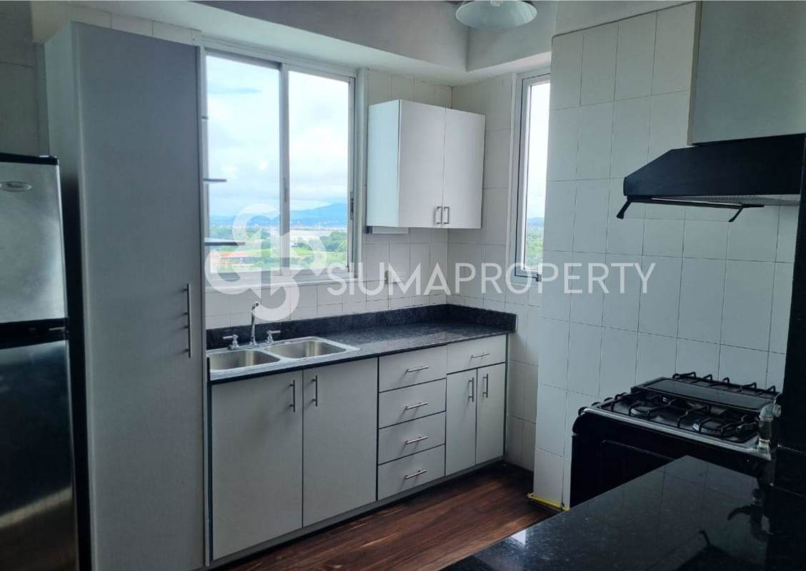 Bright living and dining space opening onto a balcony with city views in PH Vita Bella El Cangrejo Panama City