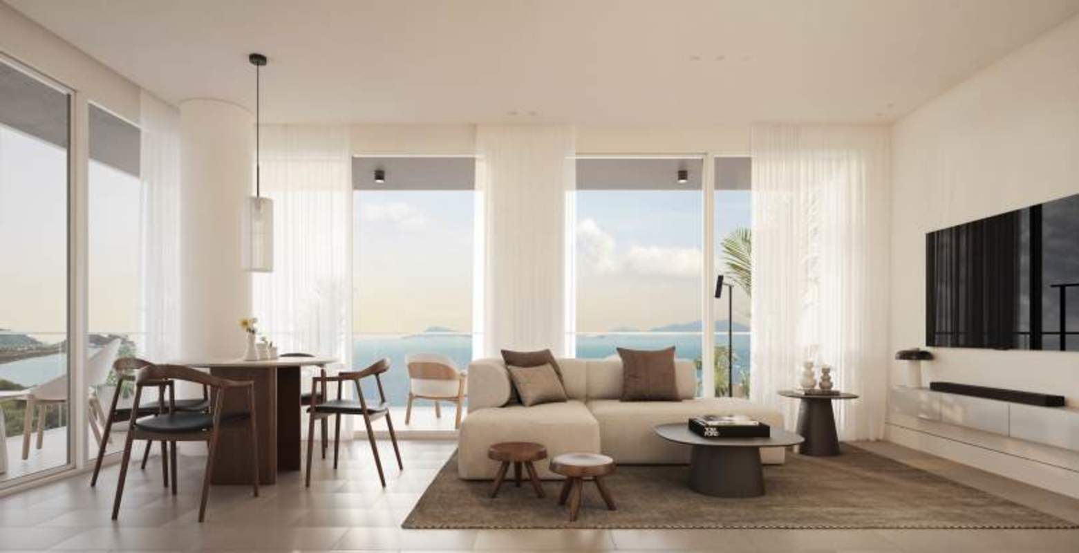 Waterfront living room with TV, large windows, modern decor in PH Nautilus Amador
