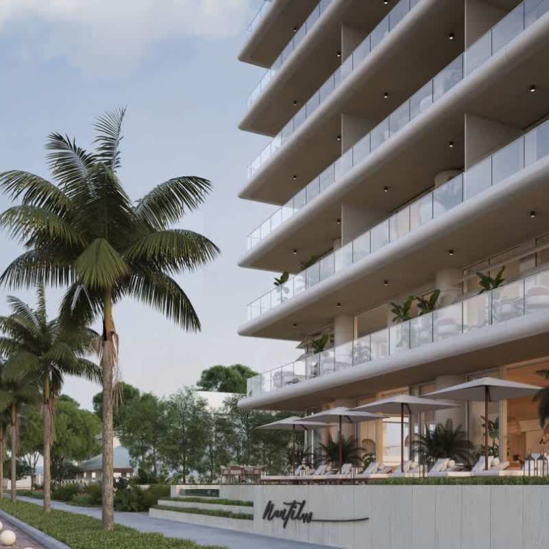 Elegant open-plan living room in Nautilus Amador with floor-to-ceiling oceanfront windows