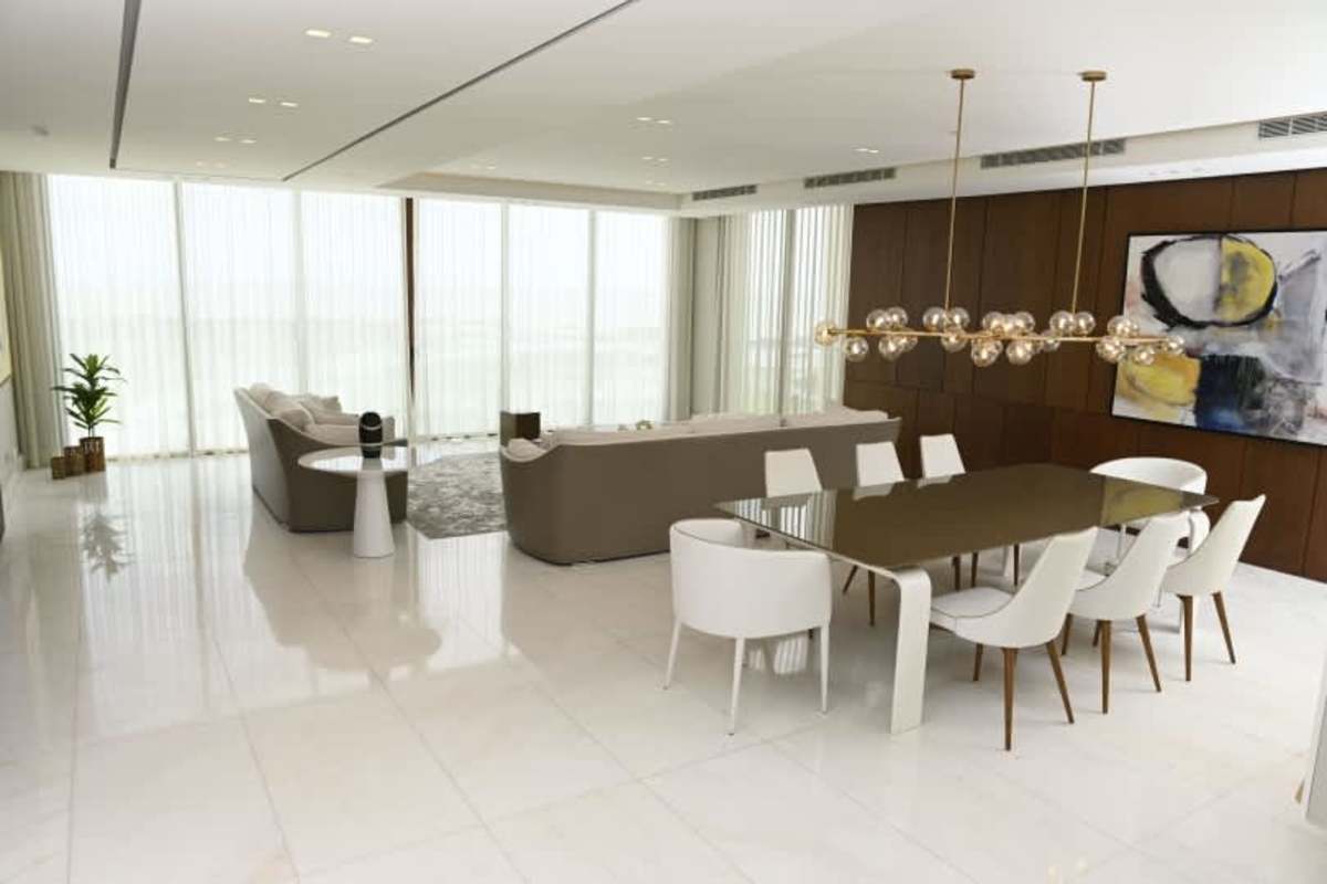 Spacious dining room with floor-to-ceiling windows and view at PH Ocean Waves Panama