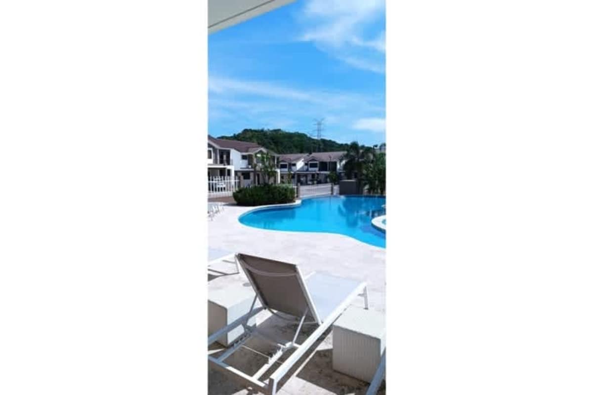 Residential townhouses with pool surrounded by greenery at Paseo del Norte Panama