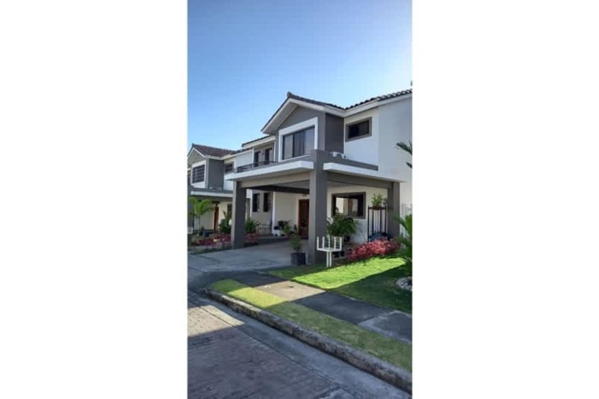 Two-story modern single-family home with balcony, carport and landscaped front yard Paseo del Norte Panama