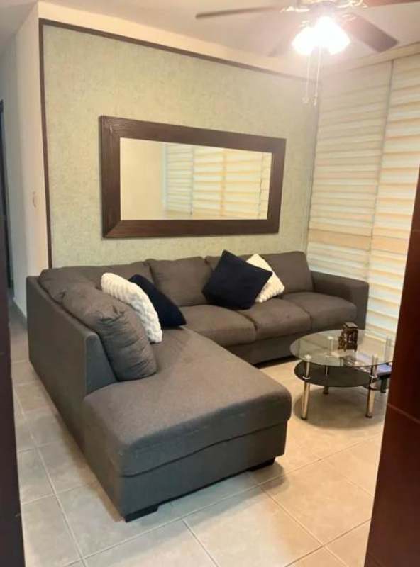 Living dining room with sectional sofa dining table ceiling fan PH Costa del Este Park Panama