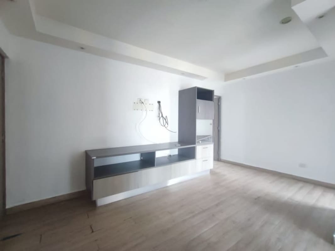 Contemporary kitchen with granite countertops, white cabinetry, and built-in appliances PH Bayside Tower Panama City