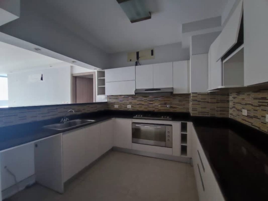 Open concept living room with TV area and laminate floors at PH Bayside Tower Panama City