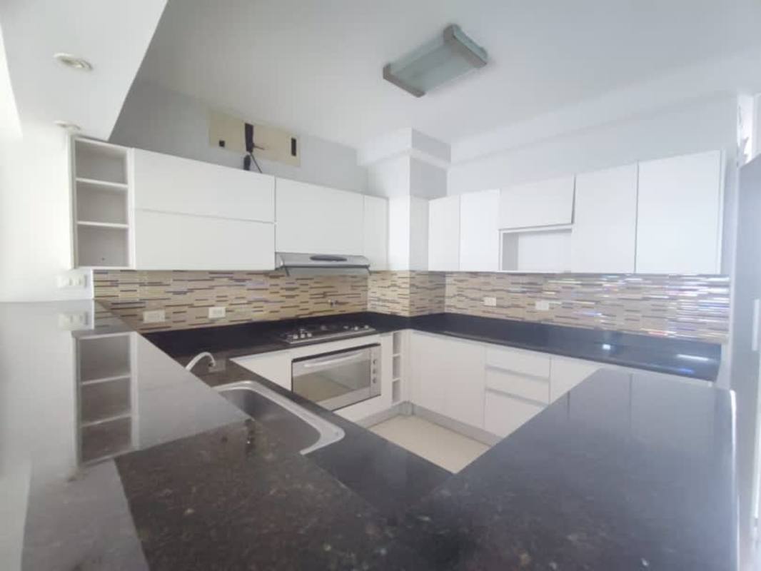 Bathroom with granite countertop, walk-in shower and modern fixtures at PH Bayside Tower Panama City