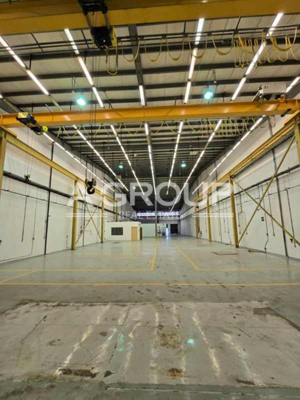 Partitioned office with lighting inside logistics warehouse Centro Logístico Milla 8 Panama