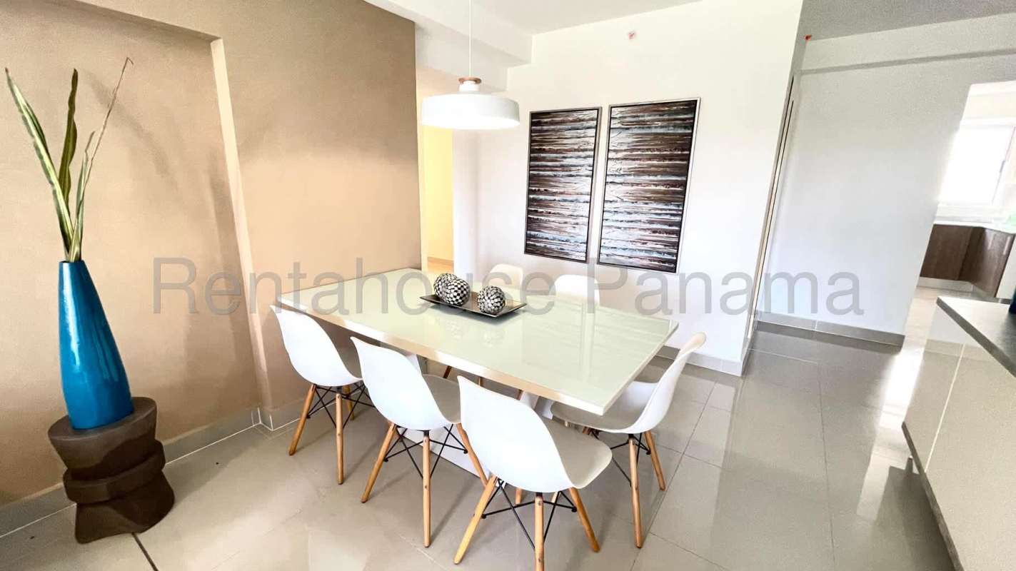 Bright open-plan living dining room in PH Residencias del Sol Carrasquilla Panama with large windows and modern design