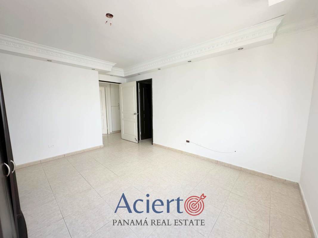 Spacious master bedroom with city view windows and built-in closets in PH San Francisco Tower