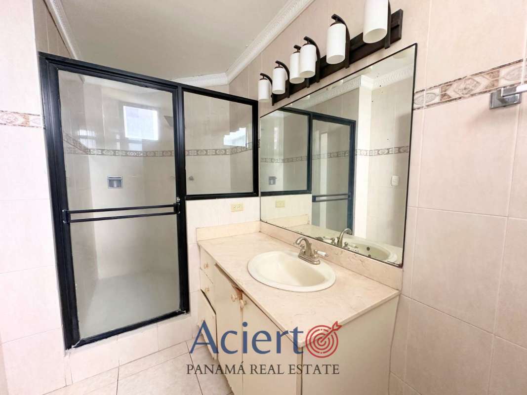 Kitchen with granite countertops, yellow-accent cabinets in PH San Francisco Tower Panama City