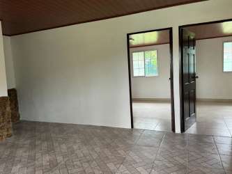 Traditional tiled bathroom with pedestal sink and shower at country home El Espino Panama
