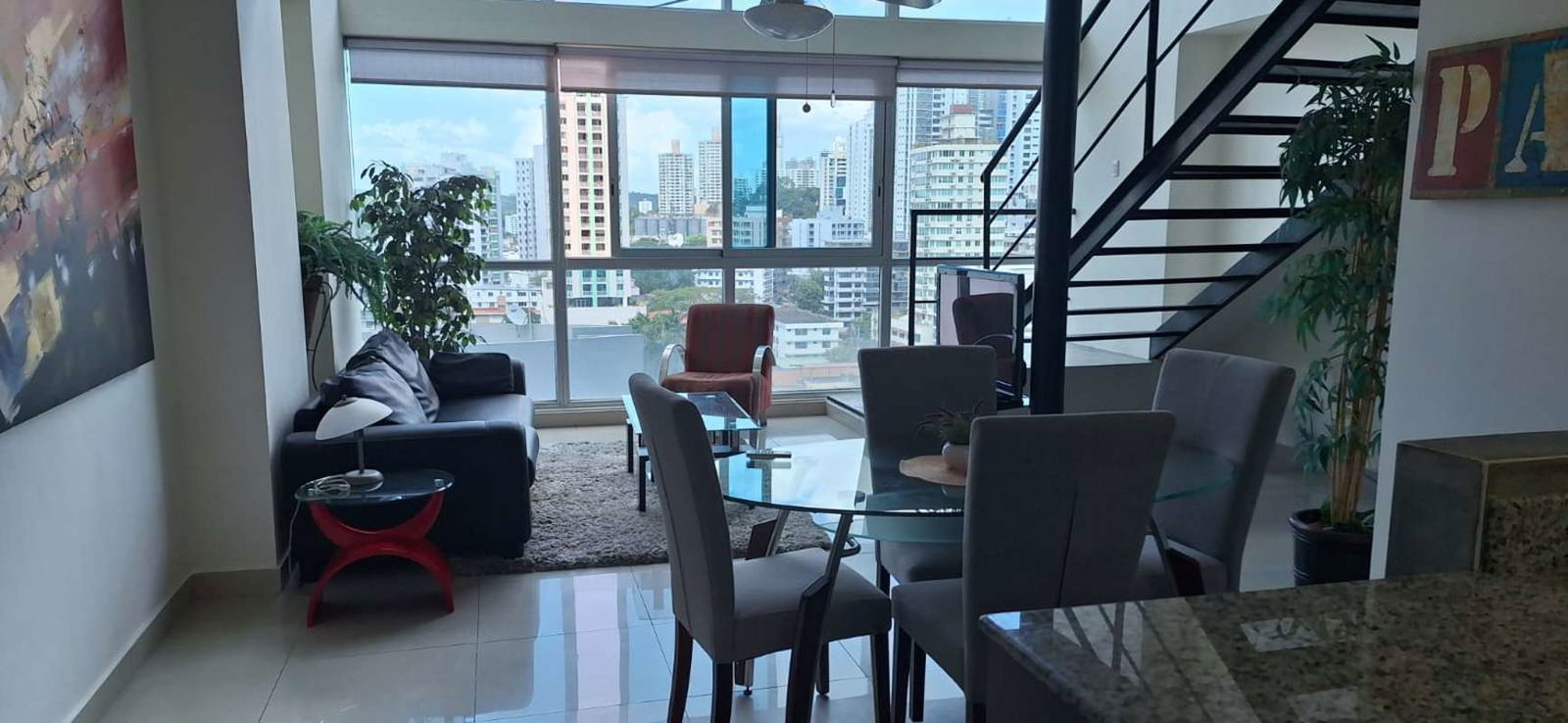 Open floor plan living dining with large glass windows PH Vitroloft El Cangrejo Panama