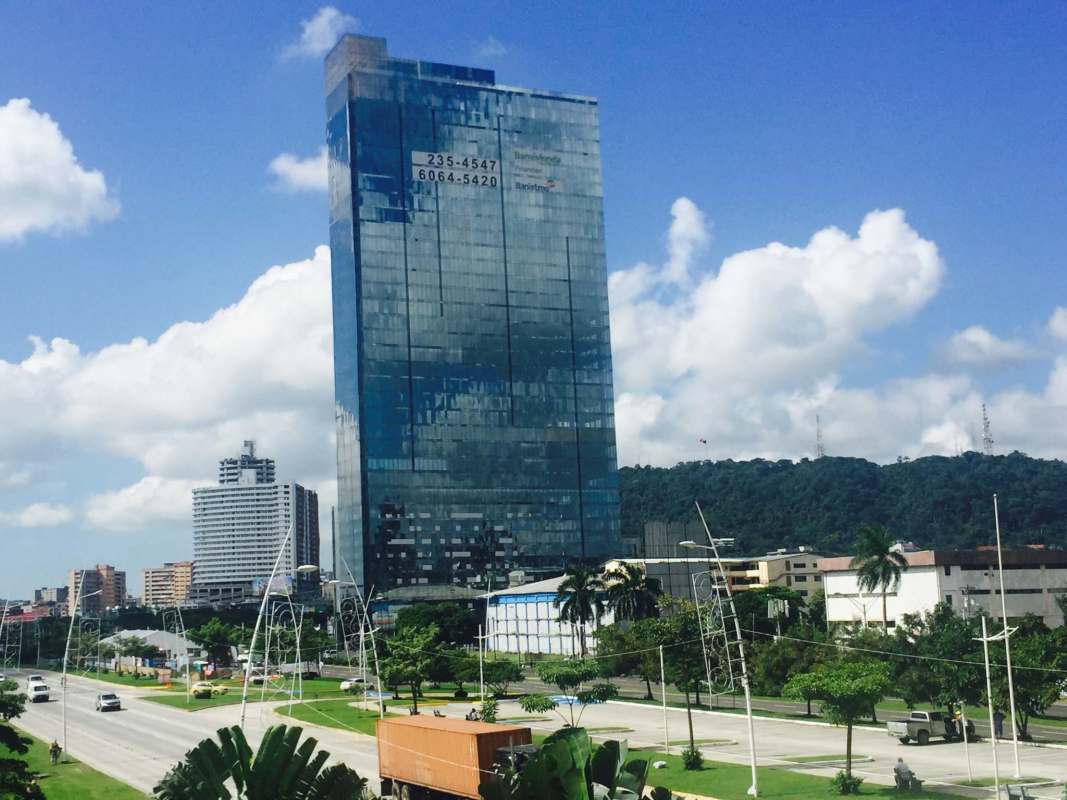 Panoramic window corner office overlooking city skyline and bay in PH Balboa Office Center Ave Balboa Panama