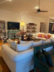 Open plan bright living room with terracotta tile and natural lighting at Coronado beach house rental Panama