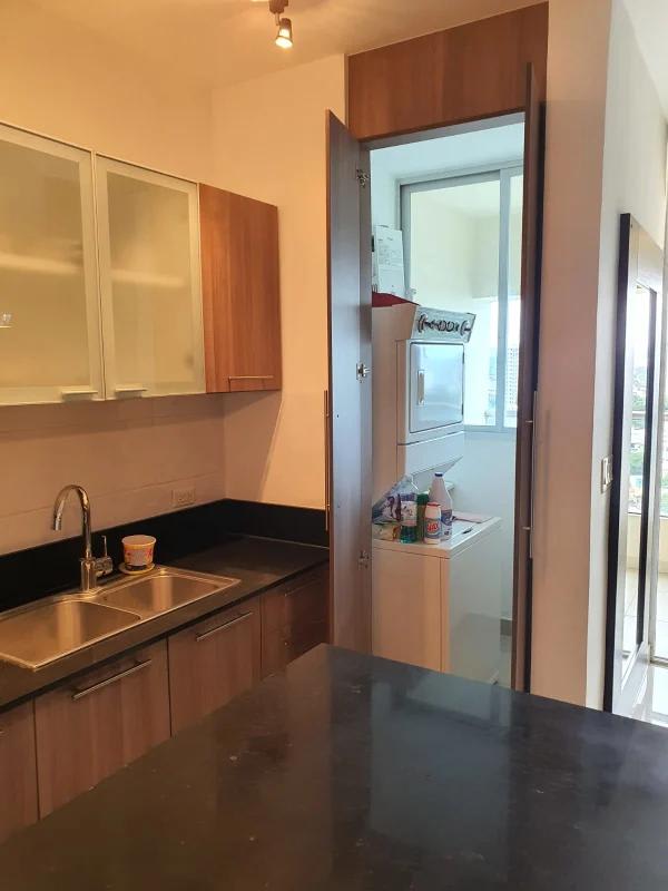 Open living room with balcony access in PH Diamond Tower apartment in San Francisco Panama City