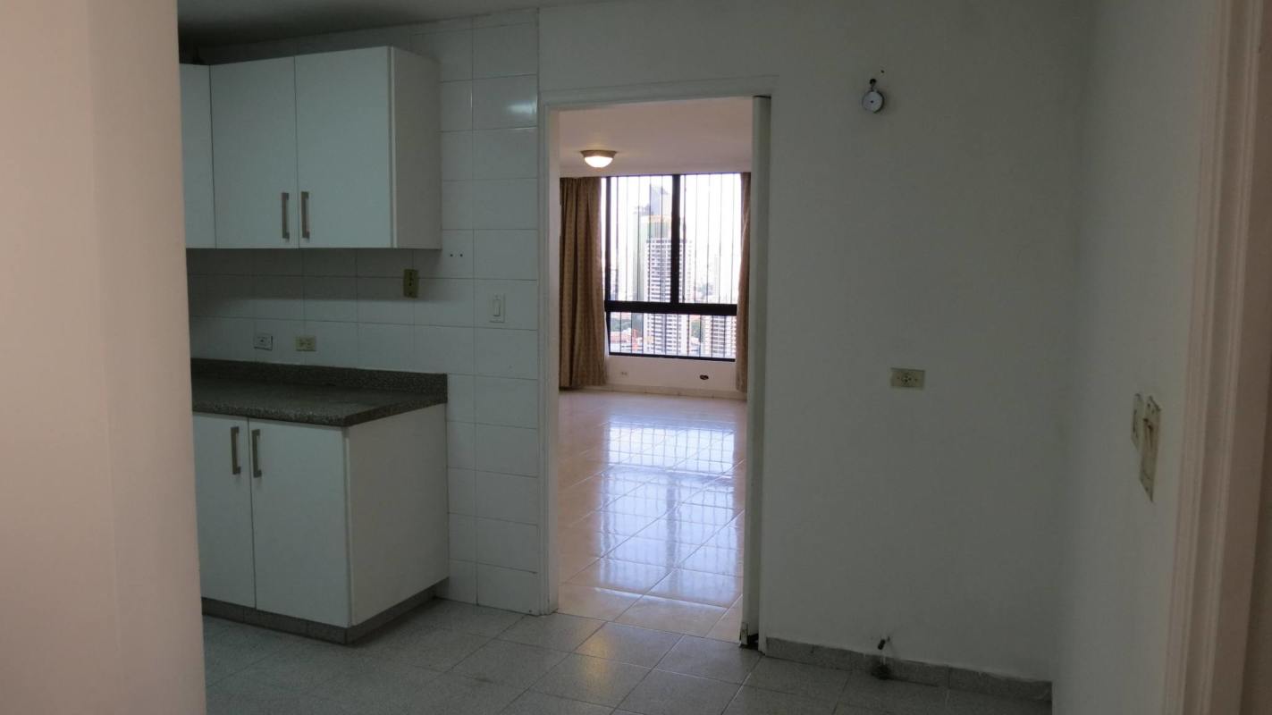 Kitchen with granite countertops, white cabinets in PH Paitilla Tower Punta Paitilla Panama City
